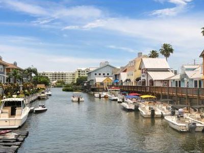 Canal leading out to the Intercoastal Waterway, Gulf Gate boat docks, restaurants, bars, pubs, stores, and shops.